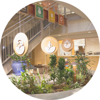 Interior of Seventh Generation headquarters featuring three of our values displayed from ceiling